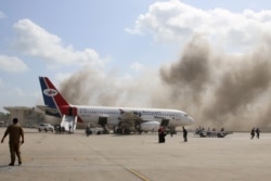 Dust rises after explosions hit Aden airport, upon the arrival of the newly-formed Yemeni government in Aden, Yemen, Dec. 30, 2020.