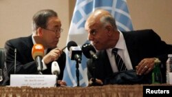 U.N. chief Ban Ki-moon, left, confers with the deputy house speaker in Tobruk, Emhemed Shoaib, in Tripoli Oct. 11, 2014.