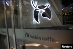 FILE - A Luckin Coffee logo is seen at a closed store in Beijing, following the novel coronavirus disease (COVID-19) outbreak, China, April 16, 2020.