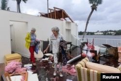 A Bayou West nonmigratory  and person  effort   to salvage items from her location  aft  an evident  tornado touched down   connected  the cardinal  formation  assemblage  aft  Hurricane Milton successful  Vero Beach, Fla., Oct.11, 2024. (Kaila Jones/USA Today Network via Reuters)