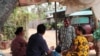 Hy Sokhom pictured with his family, as they gather at their home in Kien Svay district, Kandal province, Cambodia, April 12, 2020.