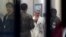 FILE - South Korean army soldiers talks with a medical doctor as he prepares to treat an unidentified injured person, unseen, believed to be a North Korean soldier, at a hospital in Suwon, South Korea, Nov. 13, 2017.