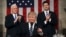 U.S. President Donald Trump, flanked by Vice President Mike Pence and House Speaker Paul Ryan of Wisconsin, gestures on Capitol Hill in Washington before his address to a joint session of Congress, Feb. 28, 2017.