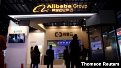 FILE PHOTO: An Alibaba Cloud sign is seen at the Alibaba Group booth during the fourth World Internet Conference in Wuzhen
