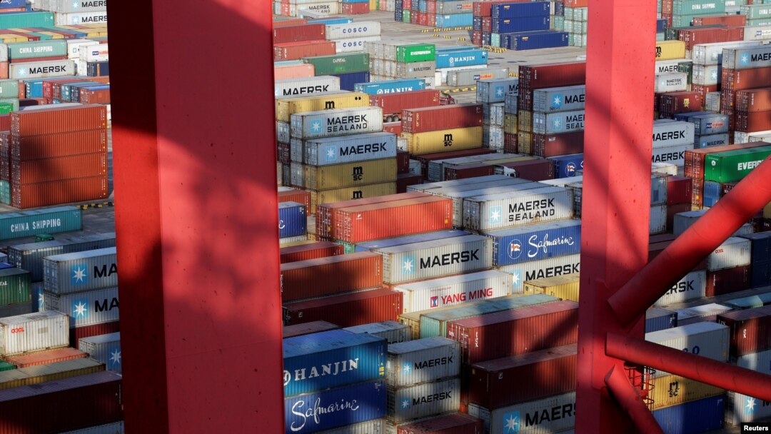 FILE - Containers are seen at the Yangshan Deep Water Port in Shanghai, China, Sept. 24, 2016. 