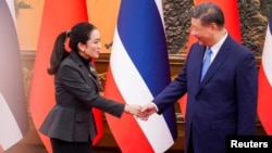 Thailand's Prime Minister Paetongtarn Shinawatra, left, meets with Chinese President Xi Jinping in Beijing, China, Feb. 6, 2025. (Thailand Government House handout via Reuters)