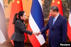 Thai Prime Minister Paetongtarn Shinawatra shakes hands with Chinese President Xi Jinping during their meeting in Beijing, China, on Feb. 6, 2025. (Thailand Government House via Reuters)