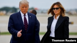 FILE PHOTO - U.S. President Donald Trump walks with first lady Melania Trump at Cleveland Hopkins International Airport in Cleveland