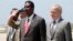 The United Nations envoy for Somalia, Nicholas Kay (R), is welcomed by Somalia's Information Minister Abdullahi Ilmoge at the airport in Somalia's capital Mogadishu, June 2013.