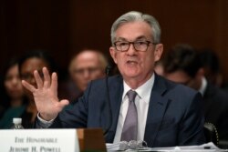 FILE - Federal Reserve Chairman Jerome Powell testifies before a congressional committee on Capitol Hill in Washington, Feb. 12, 2020.