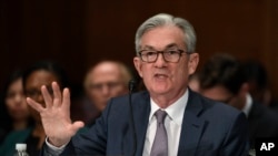 FILE - Federal Reserve Chairman Jerome Powell testifies before the Senate Banking Committee on Capitol Hill in Washington, Feb. 12, 2020, during a hearing on the Monetary Policy Report. 