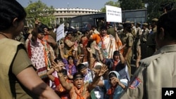 Women activists of India's main opposition Bharatiya Janata Party (BJP) shout slogans during a protest against the ruling government for the women's reservation bill in front of parliament in New Delhi, March 9, 2010.