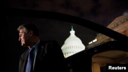 US Senator Joe Manchin, a West Virginia Democrat, looks on as he talks to reporters as he leaves the US Capitol in Washington, Dec. 15, 2021. 