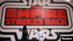 FILE - Vintage action figures of Star Wars characters Darth Vader (L) and Luke Skywalker stand on a table ahead of an auction of Star Wars and film related toys at the Vectis auction house in Stockton-on-Tees, Britain, Nov. 23, 2015.