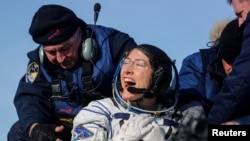 NASA astronaut Christina Koch reacts shortly after landing of the Russian Soyuz MS-13 space capsule in a remote area southeast of Zhezkazgan in the Karaganda region of Kazakhstan, February 6, 2020. 