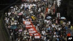 Marches in Hong Kong on Sunday, July 29, 2012 protest Beijing-approved "national education" plans.