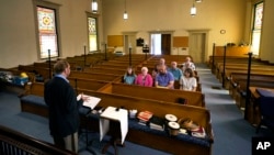 Minister Greg Foster delivers a sermon at Waldoboro United Methodist Church, Sunday, June 20, 2021, in Waldoboro, Maine. (AP Photo/Robert F. Bukaty)