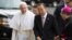 Pope Francis arrives in front of United Nations headquarters with Secretary General Ban Ki-moon, Sept. 25, 2015. 
