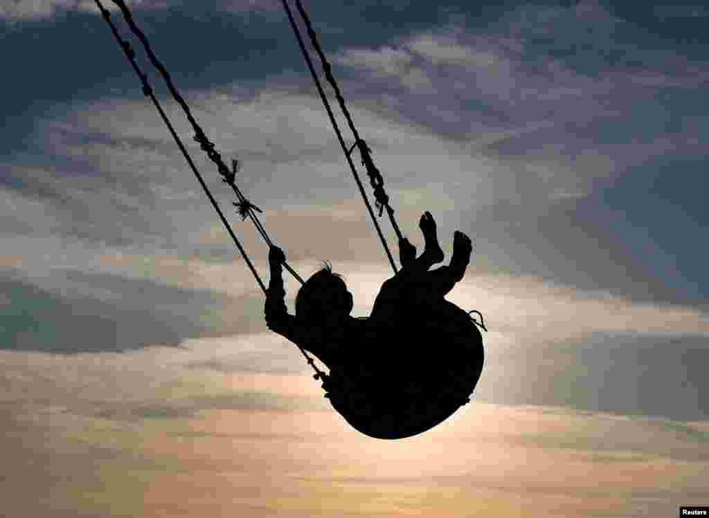 A displaced Palestinian child plays amid the Israel-Hamas conflict, in Khan Younis, southern Gaza Strip.