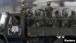 Snage lojalne predsedniku Bašaru al-Asadu u centru Damaska, 16. jula 2012.