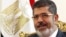Egypt's President Mohamed Mursi attends a meeting at the presidential palace in Cairo, May 16, 2013.