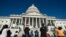 People view the flag-draped casket of Rep. John Lewis, D-Ga., as he lies in state on the East Front Steps of the Capitol in Washington, July 27, 2020.