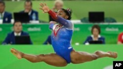 The United States' Simone Biles performs on the floor during the artistic gymnastics women's apparatus final at the 2016 Summer Olympics in Rio de Janeiro, Brazil, Aug. 16, 2016.