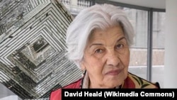 FILE -- Artist Monir Shahroudy Farmanfarmaian, shown with her work, Infinite Possibility. Mirror Works and Drawings 1974–2014, on March 10, 2015..