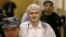 FILE - In this June 3, 2011 file photo, former Yukos CEO Mikhail Khodorkovsky's co-defendant Platon Lebedev, surrounded by guards, walks to a courtroom in Moscow. 