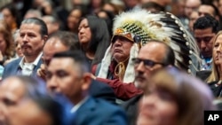 Native American attendees listen as Vice President Kamala Harris speaks during the 2024 White House Tribal Nations Summit, on Dec. 9, 2024, at the Department of the Interior in Washington.