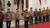 Indonesia's new President Prabowo Subianto, center, announces his cabinet lineup of newly-appointed ministers, at Merdeka Palace, in Jakarta, Indonesia, Oct. 20, 2024. 