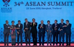 FILE - Leaders of the Association of Southeast Asian Nations (ASEAN) pose for a group photo during the opening ceremony of the ASEAN leaders summit in Bangkok, Thailand, June 23, 2019.