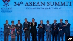  Leaders of the Association of Southeast Asian Nations (ASEAN) pose for a group photo during the opening ceremony of the ASEAN leaders summit in Bangkok, Thailand, June 23, 2019.