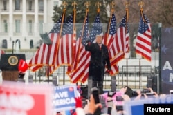 FILE - Donald Trump holds a rally to contest the certification of the 2020 presidential election results by the US Congress, in Washington, Jan. 6, 2021.