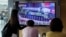 People watch a TV screen showing a file image of a North Korean missile in a military parade during a news program at the Seoul Railway Station in Seoul, South Korea, Monday, Aug. 30, 2021. 