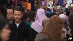 An image taken from video on April 13, 2016 shows Salah Abdeslam (2nd L), the fugitive from the Nov. 13 Paris attacks whose capture appears to have precipitated the March 22 bombing in Brussels.