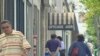 People walk down one of the main streets in Teaneck, New Jersey, where small businesses are having a rough go of it during this latest economic downturn, September 2011.