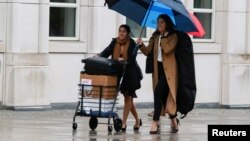 Members of Joaquin "El Chapo" Guzman's defense team arrive for the start of jury selection to United States District Court for the Eastern District of New York in Brooklyn, New York, Nov. 5, 2018. 