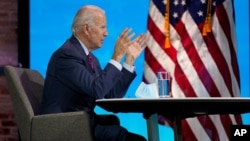 President-elect Joe Biden participates in a virtual meeting with the National Association of Counties' board of directors about jobs, at The Queen theater, Dec. 4, 2020, in Wilmington, Del. 