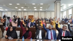 FILE - Somali legislators of the lower house of parliament take a vote, in Mogadishu, Somalia, April 12, 2021.