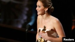 Actress Jennifer Lawrence accepts the award for best actress for her role in "Silver Linings Playbook" at the 85th Academy Awards in Hollywood, California Feb. 24, 2013. 