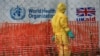 FILE PHOTO: A person dressed in Ebola protective apparel is seen inside an Ebola care facility at the Bwera general hospital near the border with the Democratic Republic of Congo in Bwera, Uganda, June 14, 2019. REUTERS/James Akena/File Photo