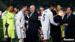 Real Madrid's Cristiano Ronaldo with Fifa President Gianni Infantino after a match between Real Madrid and the Kashima Antlers at International Stadium Yokohama - Japan, Dec. 12, 2016.