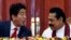 Japan's Prime Minister Shinzo Abe (L) talks with Sri Lankan President Mahinda Rajapaksa during their bilateral meeting at the President Secretariat after in Colombo, September 7, 2014.
