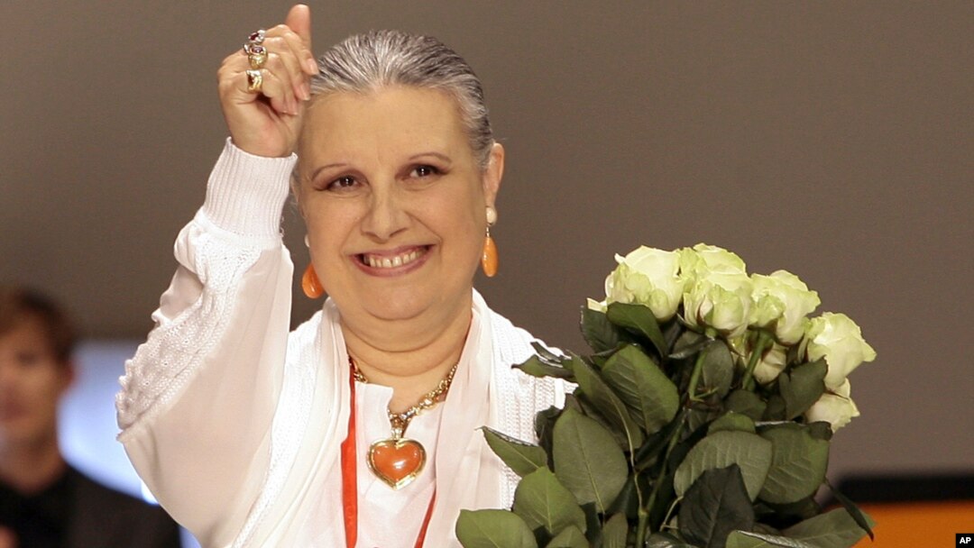 FILE - Italian Fashion designer Laura Biagiotti acknowledges the applause at the end of one of her shows in downtown Milan, Italy, June 24, 2007.