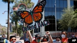 Protesters chant in front of the U.S. Immigration and Customs Enforcement building during a rally after the U.S. Supreme Court ruled on the Deferred Action for Childhood Arrivals program, in Phoenix, June 18, 2020.