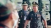 Cambodian Prime Minister Hun Sen's son, Lt. Gen. Hun Manet, right, arrives for handing over ceremony at National Olympic Stadium in Phnom Penh, Cambodia, Thursday, June 18, 2020. (AP Photo/Heng Sinith) 