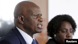 FILE: Zimbabwe's Finance Minister Patrick Chinamasa (L) addresses a media conference after meeting International Monetary Fund (IMF) Executive Director for Africa Chileshe Kapwepwe (R) in Harare, September 7, 2015.