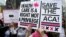 FILE - Protesters gather across the Chicago River from Trump Tower to rally against the repeal of the Affordable Care Act, March 24, 2017, in Chicago. 