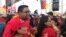 FILE - Irfaan Ali, presidential candidate for Guyana's opposition People's Progressive Party, meets with supporters, ahead of the March 2nd presidential election, in Georgetown, Guyana, Jan. 18, 2020.